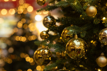 Christmas tree with golden balls, festive season with happy new year, winter forest with fresh snow.