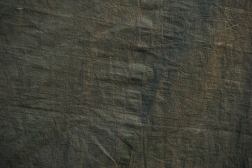 Dark green canvas texture with a worn look