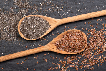 Wooden spoons with chia seeds and flax seeds