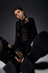 Naklejka premium Spooky season look with braided hair in gothic Wednesday style dress for Halloween joy