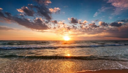 beautiful sunrise over tranquil ocean waters with colorful cloudy sky and gentle waves