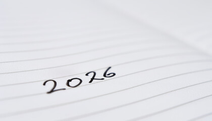 A background image with the date "2026" neatly written on a clean page, perfect for concepts related to New Year, business planning, education, or personal development