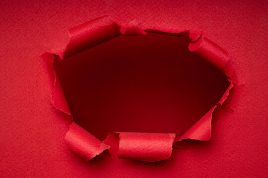 Red torn paper hole, bold banner background with copy space