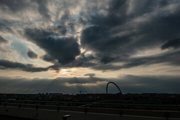 Cloudy sky above the Turin skyline, light and shadow blending on the urban profiles, atmosphere at sunset. Weather forecast for the city suspended between clouds and iconic silhouettes.