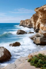 Obraz premium Ocean waves crashing against rugged sandstone cliffs