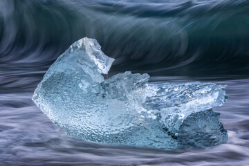 Iceberg and Waves on Diamond Beach Iceland
