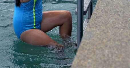 Child exiting the lake via ladder in slow-motion at 800 fps, highlighting the effort and...