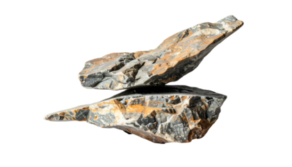 Two textured grey & orange rocks stacked, isolated on black