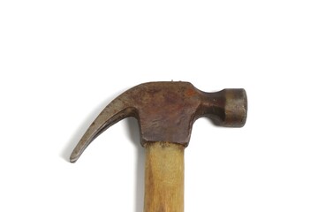 A well-used rusty claw hammer with a wooden handle on a clean white background