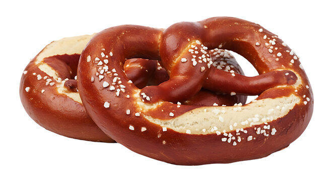 Two deliciously baked soft pretzels with coarse salt sprinkled on top against a black background