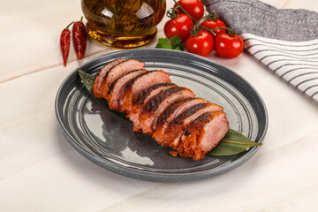 Sliced duck breast baked with cherry