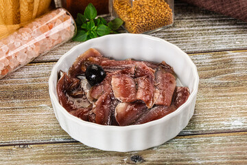 Canned anchovy with oil in the bowl