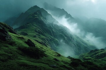Green mountain peaks with rising fog