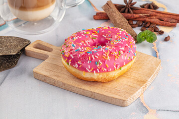 Sweet donut with strawberry icing