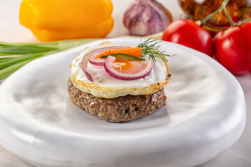Beefsteak chop with roasted egg