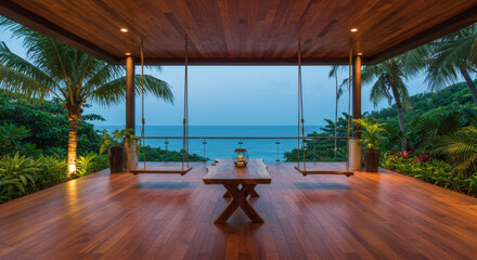 Obraz premium A spacious terrace with an ocean view, wooden flooring, swings and a wooden table, surrounded by plants and soft lighting