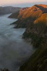 Mountainous landscape at sunrise foggy valley nature photography scenic view majestic atmosphere