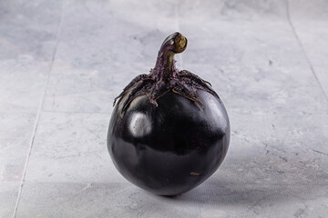 Raw round black big eggplant
