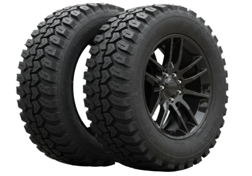 Isolated two rugged off-road tires with aggressive tread pattern and black alloy wheels ready for adventure and extreme terrain driving