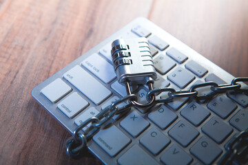 Keyboard locked with chain and padlock. Internet security concept.