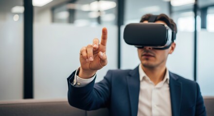Caucasian young male experiencing virtual reality with headset in office setting
