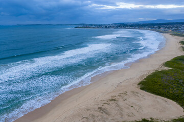 Drone aerial photograph of the South Pacific Ocean and beach at Windang Bay near the coastal town of Warilla in the Illawarra region on the south coast of NSW, Australia.