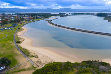 Drone aerial photograph looking towards Lake Illawarra from the coastal town of Warilla in the Illawarra region on the south coast of NSW, Australia.