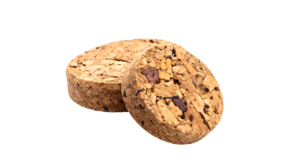 Two oval cork stoppers on a black background