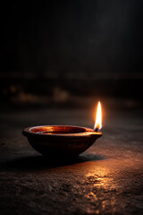 burning candle in a bowl diwali
