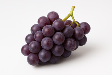 Fototapeta premium Fresh bunch of dark purple grapes on a white background