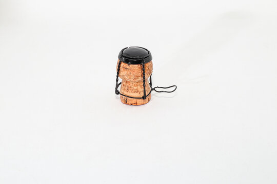Champagne wine cork with muselet Isolated on white background.