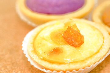vareity of bake hokkaido cheese tart on the wooden background.