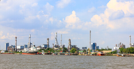 panorama view of Oil and gas industry, factory - petrochemical plant, refinery and transportation under sun light whit beautiful blue sky, Bang jak, Bangkok, Thailand © MMxeon
