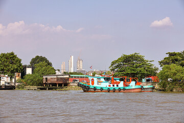 Tug boat, fire boat standby for service near Bang jak petrochemical plant, Bangkok Thailand. © MMxeon