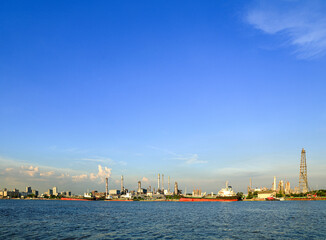 panorama view of Oil and gas industry, factory - petrochemical plant, refinery and transportation under sun light whit beautiful blue sky, Bang jak, Bangkok, Thailand © MMxeon