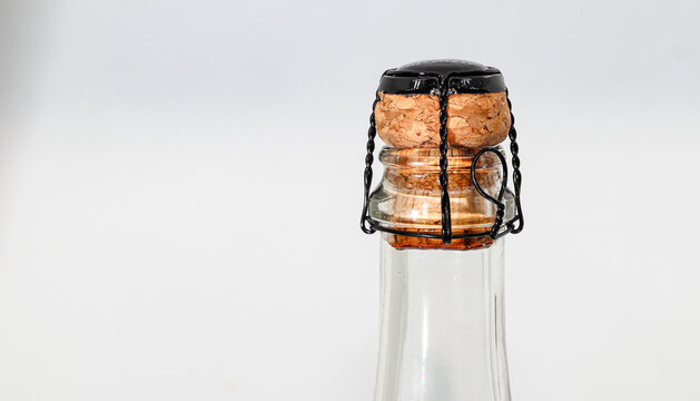 Champagne wine cork with muselet Isolated on white background.