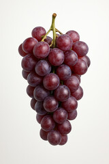 Fototapeta premium A bunch of ripe red grapes on a white background