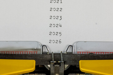 2021,2022,2023, 2024, 2025,2026 written on an old typewriter	
