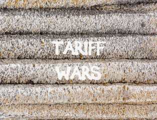 Trade tariff wars symbol. Concept word Tariff wars on beautiful grey mountain wall. Beautiful grey mountain wall background. Business trade tariff wars concept. Copy space.