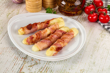 Hot mozzarella sticks with bacon