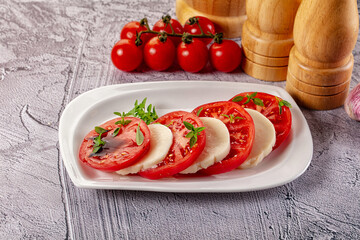 Italian caprese salad with mozzarella, tomato and basil