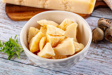 Parmesan cheese pieces in the bowl