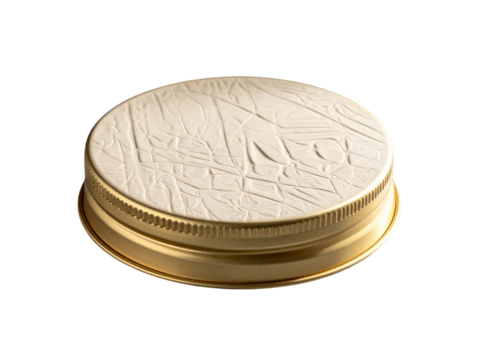 Closeup of a gold metal lid with a textured white top isolated on transparent background