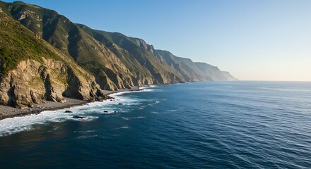 Fototapeta premium Coastal landscape with cliffs and ocean under a clear blue sky