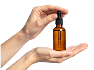 Female hands holding brown bottle with essential oil isolated on transparent background