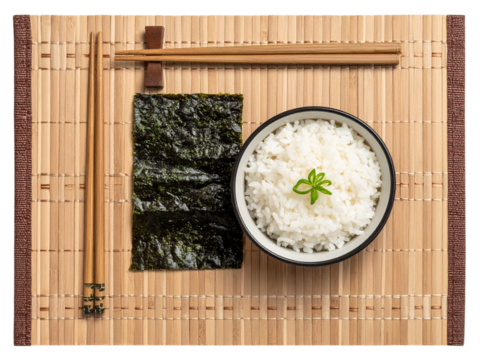 Sushi rice with nori seaweed and chopsticks on bamboo mat, top view isolated on transparent background