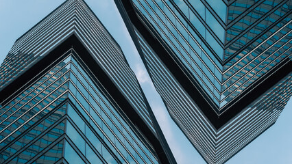 mirrored windows of the facade of an office building