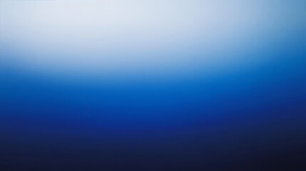 Obraz premium A soft gradient blue wallpaper transitioning from light to dark 