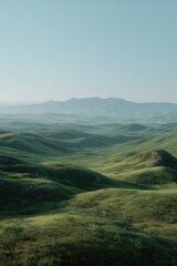 Obraz premium Verdant hills roll under a bright, clear sky