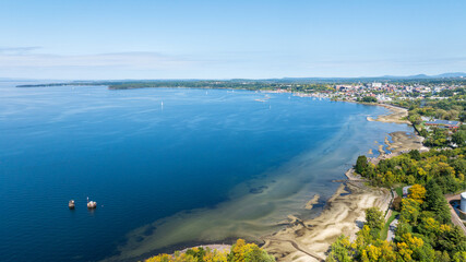 Aerial view of Burlington, Vermont with Lake Champlain's blue waters and marina stretching into the distance.